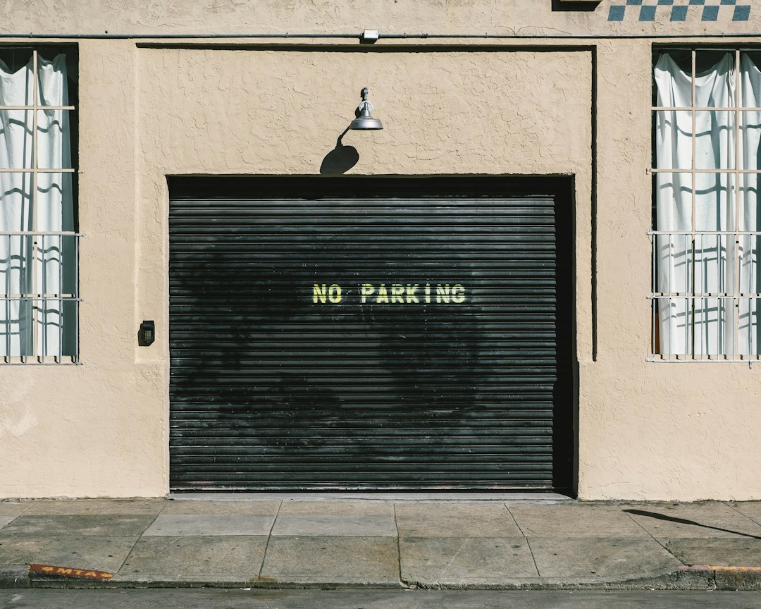 Black metal roll-up door with no parking print in Long Beach, CA